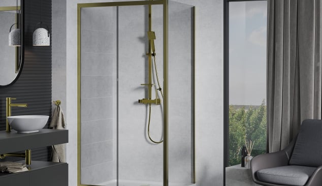 Golden fittings in a concrete bathroom